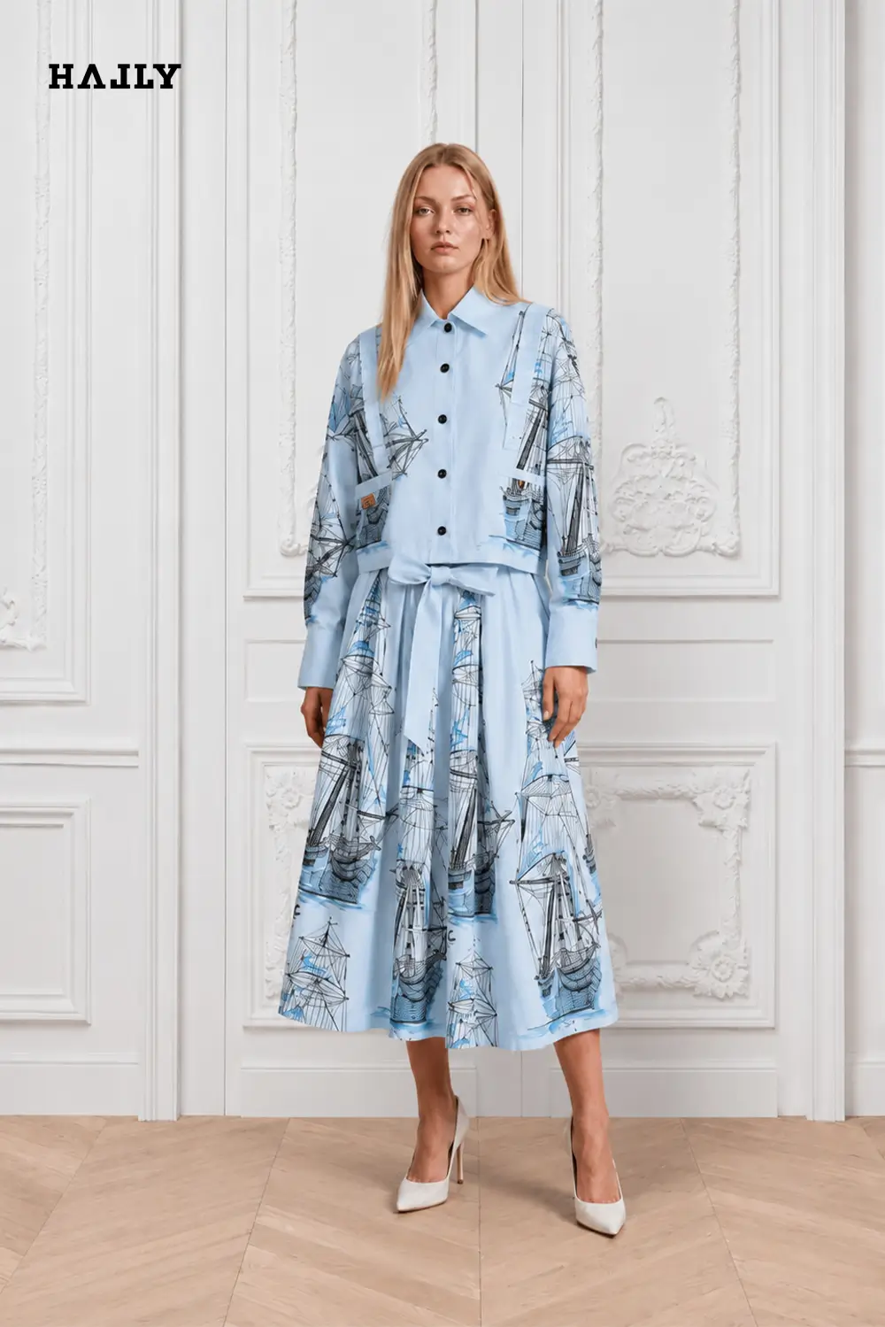 Sky-blue-shirt-and-skirt-ensemble-adorned-with-intricate-blue-sailboat-embroidery-1