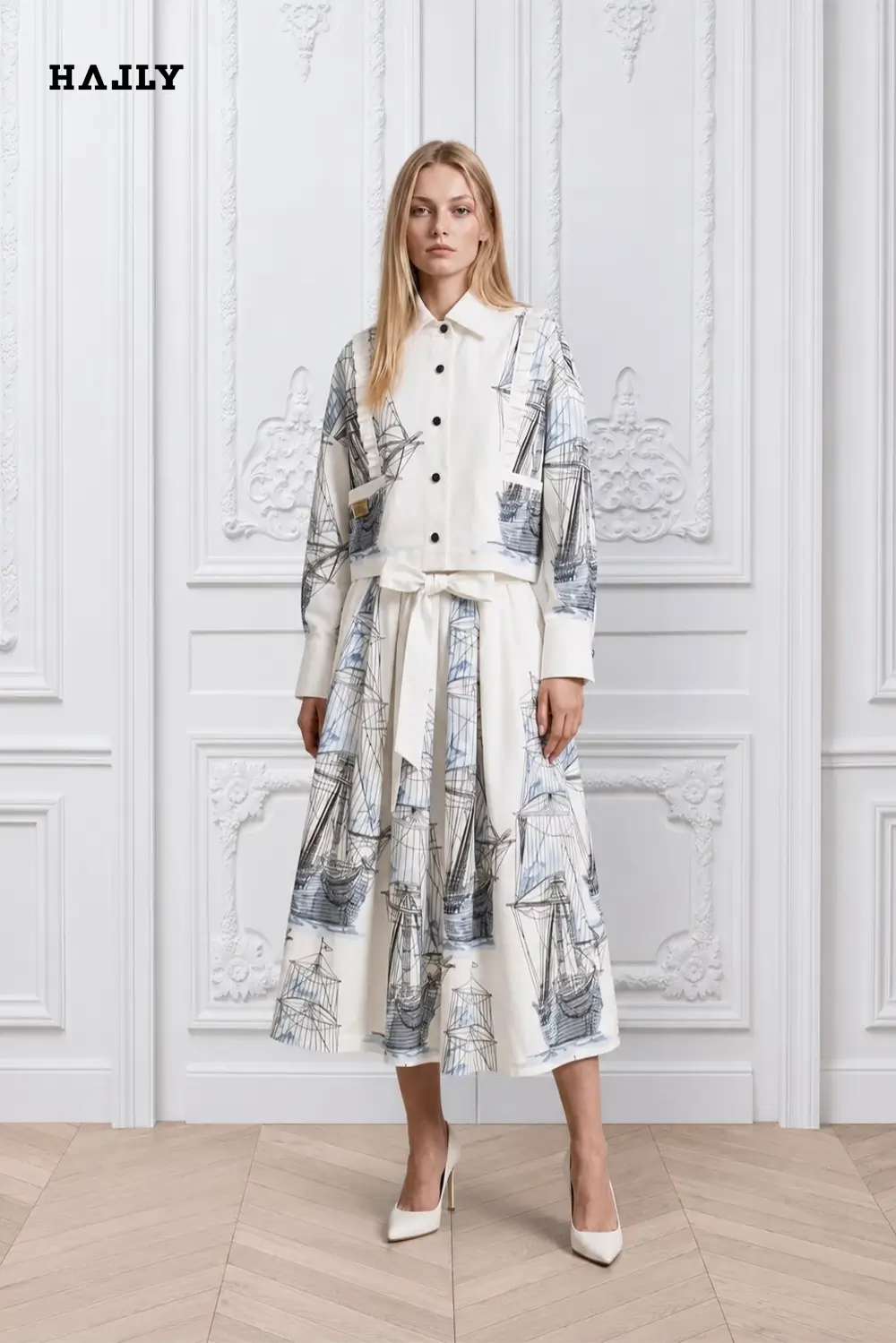 white-shirt-and-skirt-ensemble-adorned-with-intricate-blue-sailboat-embroidery-1